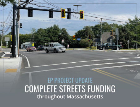 Traffic intersection with newly painted lines and ADA compliant sidewalks